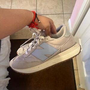 Two New Balance Pink and Blue Shoes 237